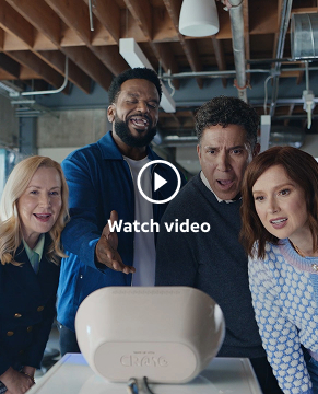 Wake Up with Craig Team (L-R: Creed, Angela Craig, Oscar, Ellie) leaning down to look at the Wake Up with Craig Clock being viewed from behind the device.